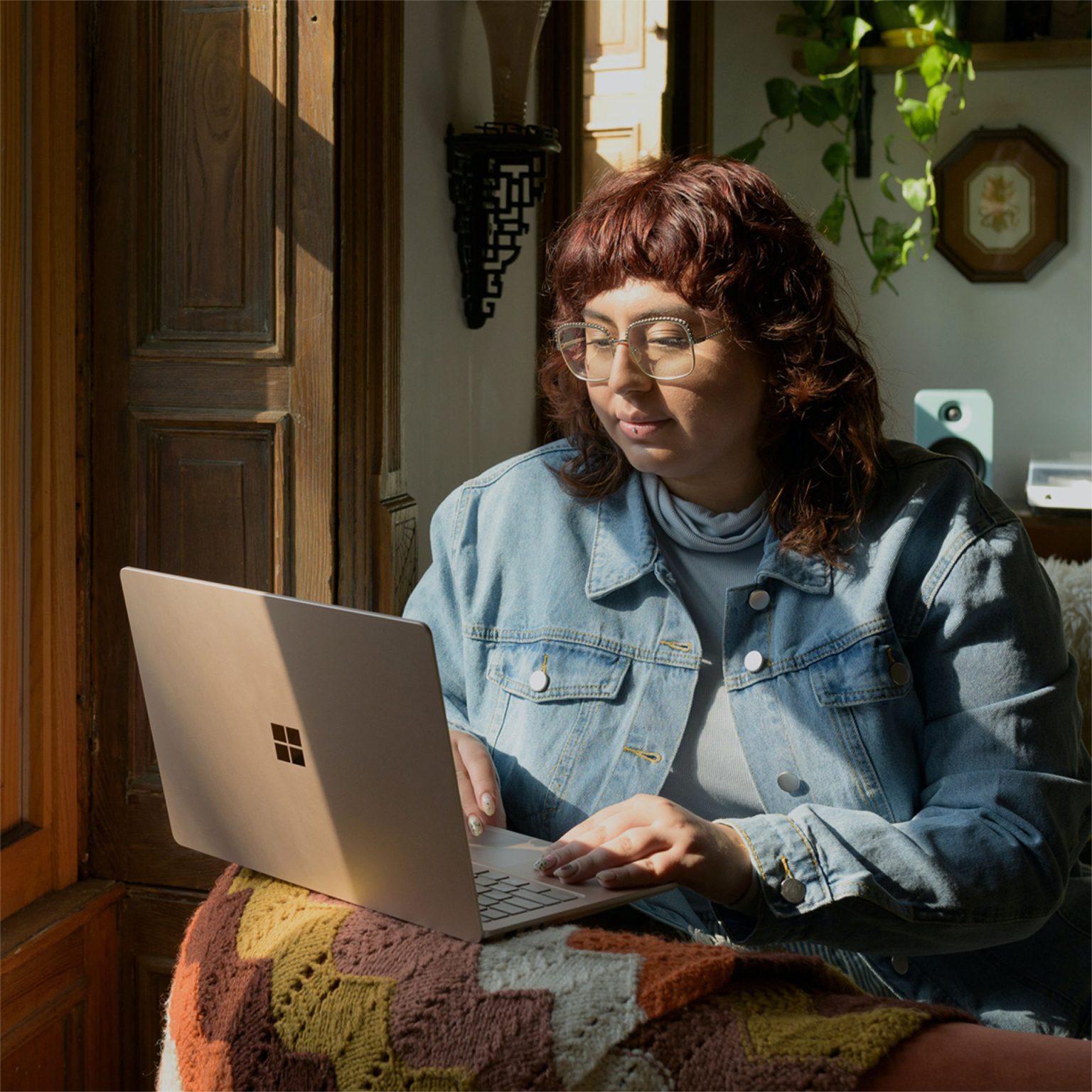 Woman researching Ketamine therapy online on her laptop.